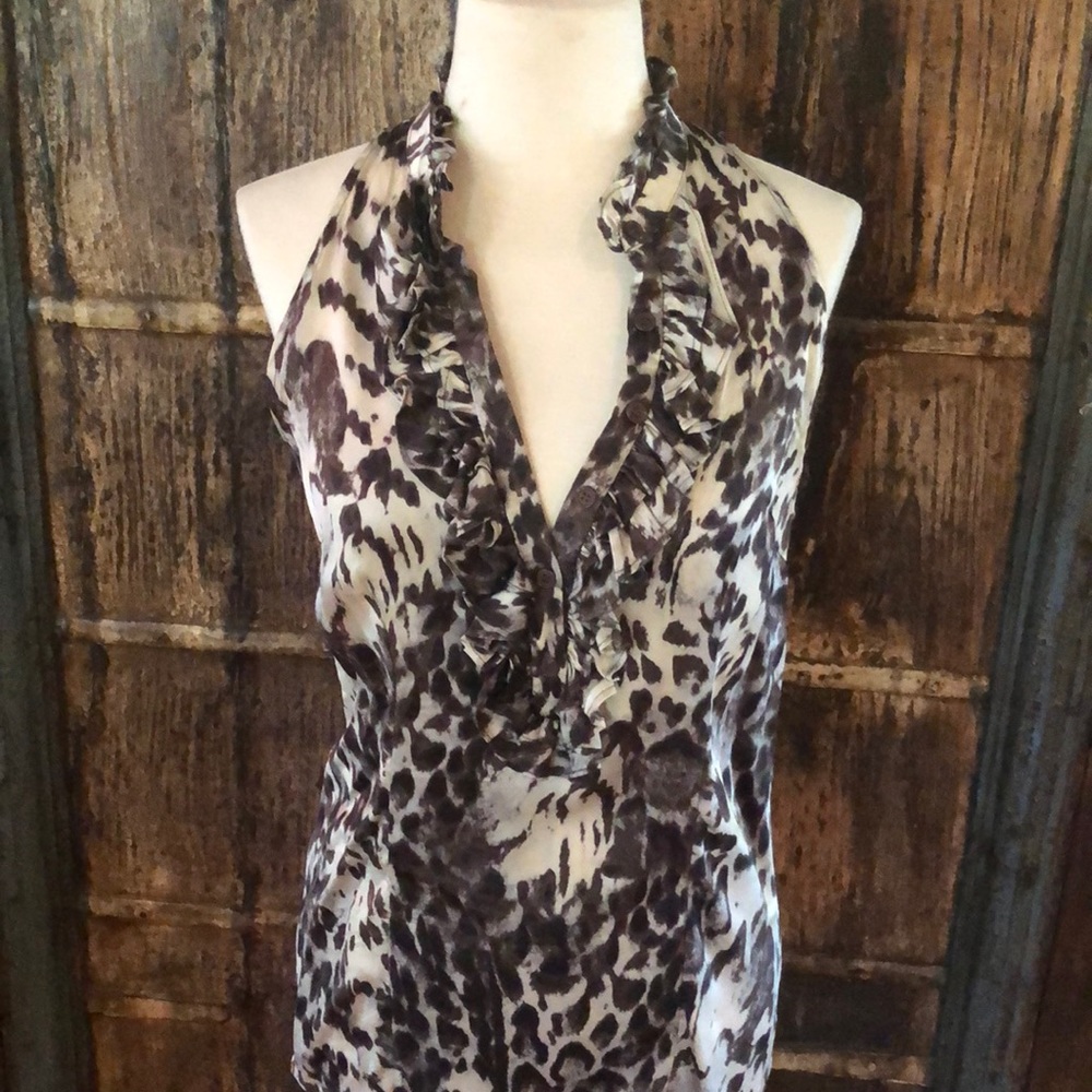 Beautiful sleeveless ruffle blouse. Animal print